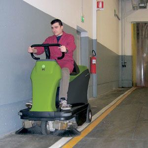 Battery Powered Rider Warehouse Sweeper In Use