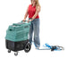 Woman pushing a large green and black CleanFreak carpet cleaning machine on wheels  Thumbnail