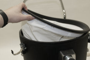 Place the cloth filter bag over the lip of the tank