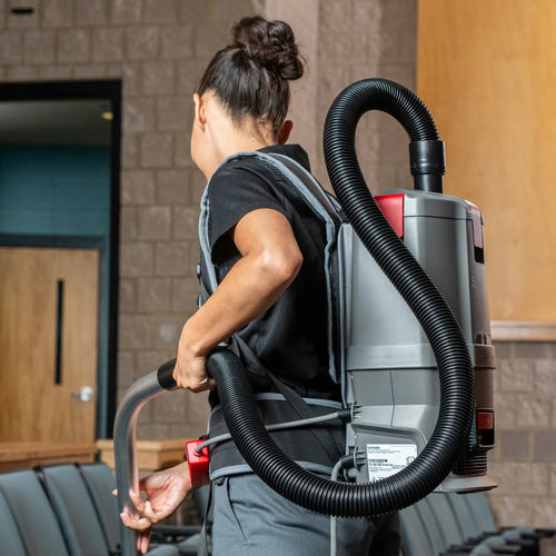 Sanitaire Transport Cord Electric Backpack Vacuum On a Cleaning Worker's Back Thumbnail