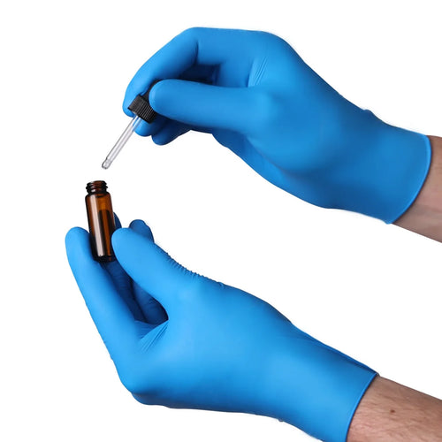 Using an Eye Dropper While Wearing Blue Powder-Free Nitrile Exam Gloves Thumbnail