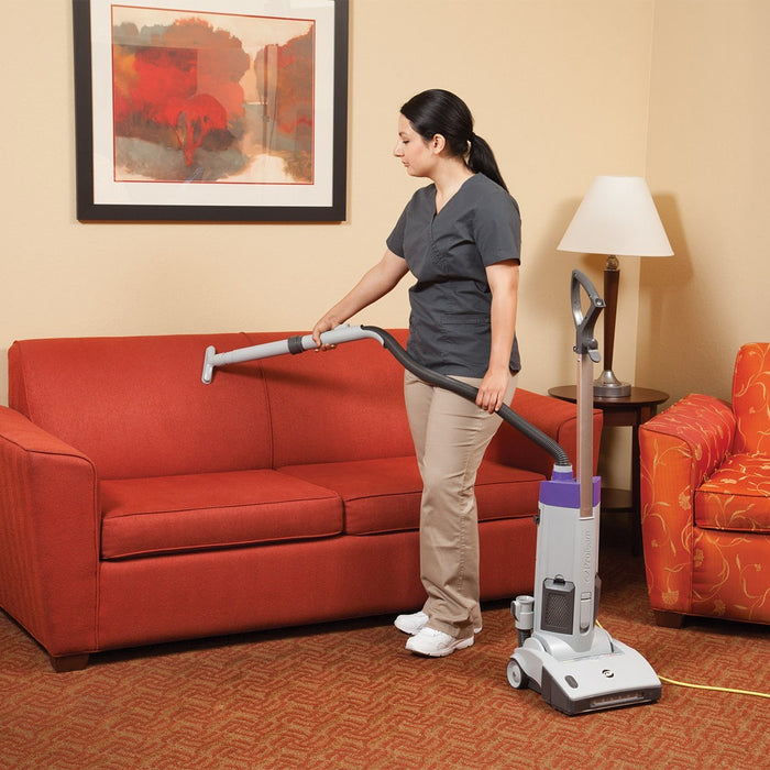 ProTeam ProGen 12 Vacuuming a Couch with the Included Tools