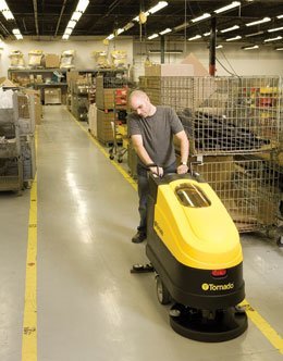 20 inch Tornado EZ Floorkeeper Being Used in a Warehouse Facility